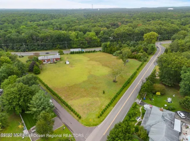 an aerial view of a house having swimming pool