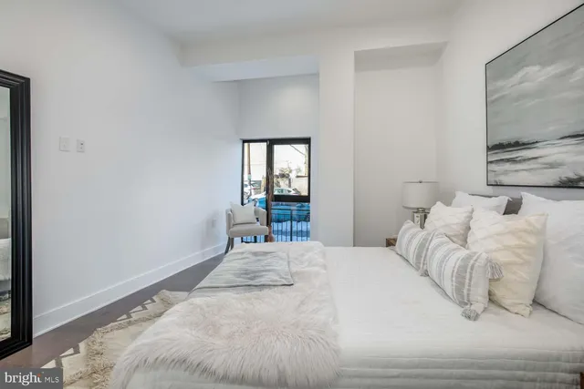 a bedroom with a bed and window