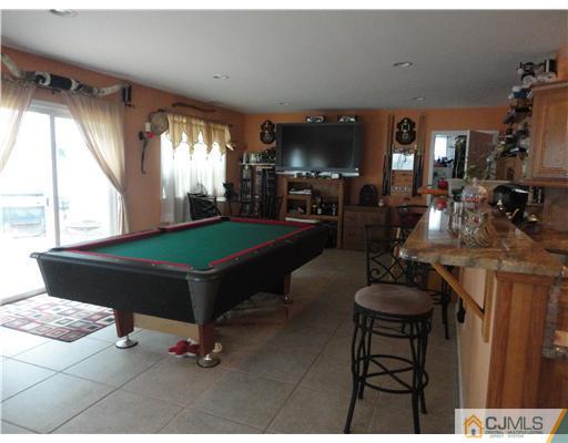 59 Ashley Road Edison, NJ 08817 - Photo 3 of 8 a living room with furniture and a large window