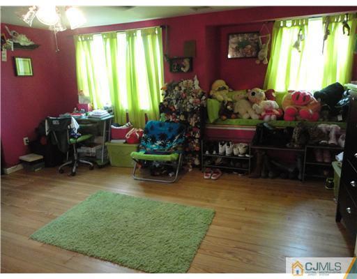 59 Ashley Road Edison, NJ 08817 - Photo 8 of 8 a living room with furniture