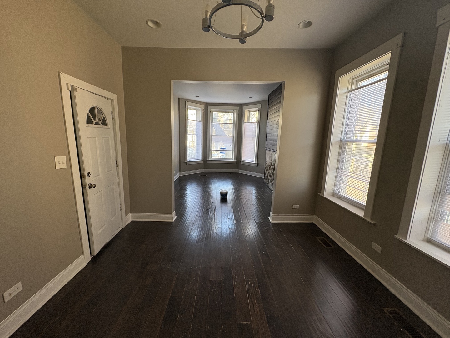 3843 West Fillmore Street Chicago, IL 60624 - Photo 19 of 38 a view of empty room with wooden floor and fan
