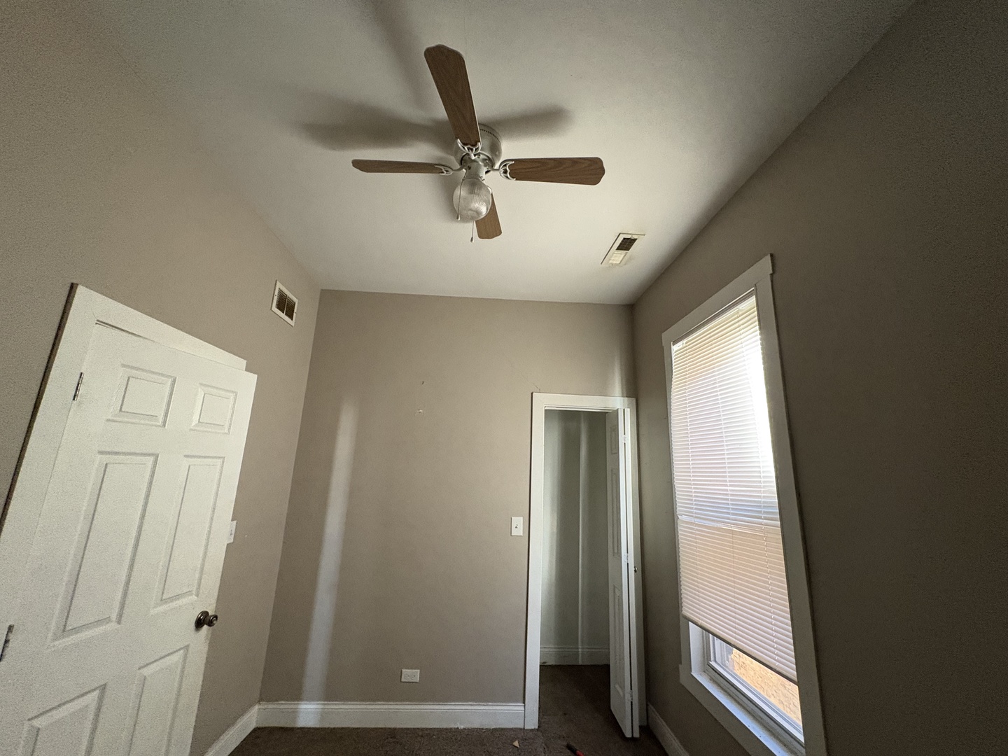3843 West Fillmore Street Chicago, IL 60624 - Photo 7 of 38 a view of a hallway with a ceiling fan