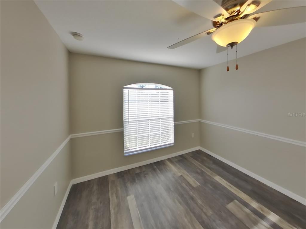 Undisclosed Address Spring Hill, FL 34608 - Photo 11 of 15 a view of an empty room with a window