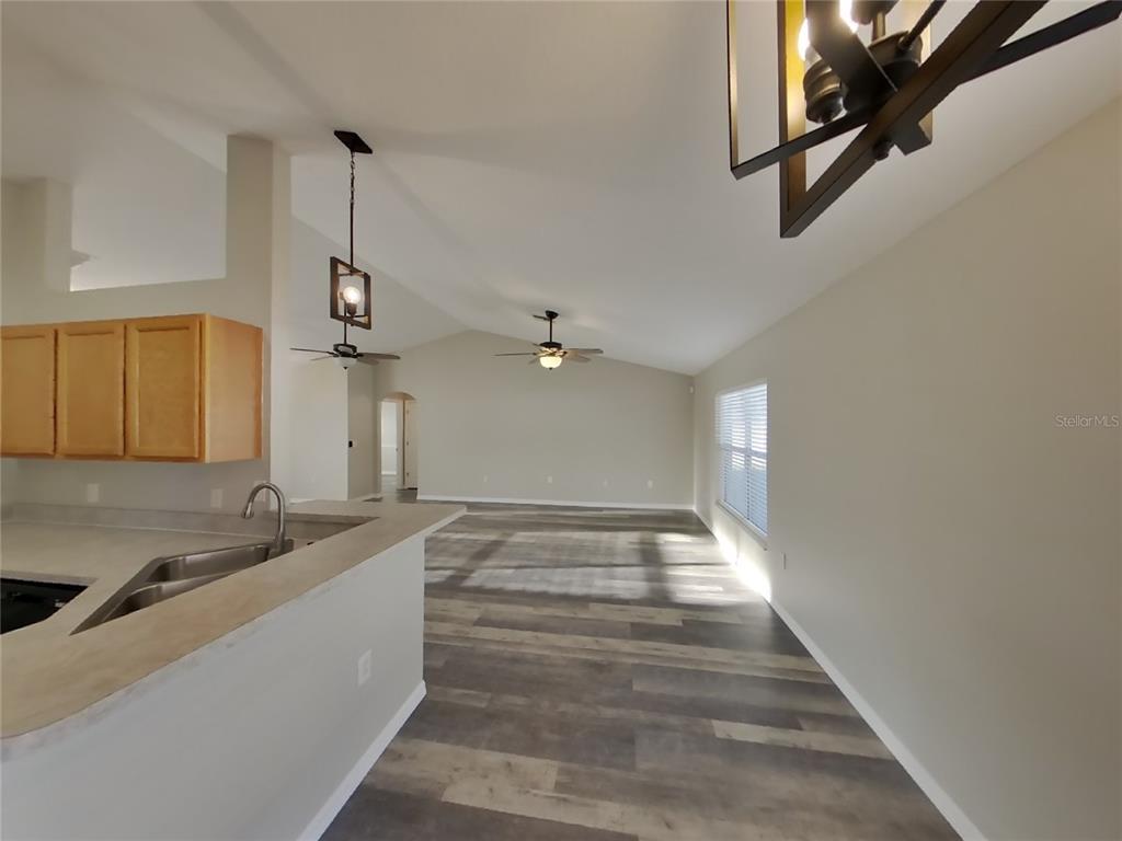 Undisclosed Address Spring Hill, FL 34608 - Photo 4 of 15 a view of a kitchen with a sink and cabinet
