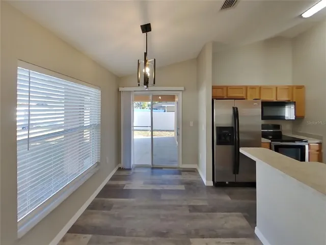 a view of a kitchen from the hallway