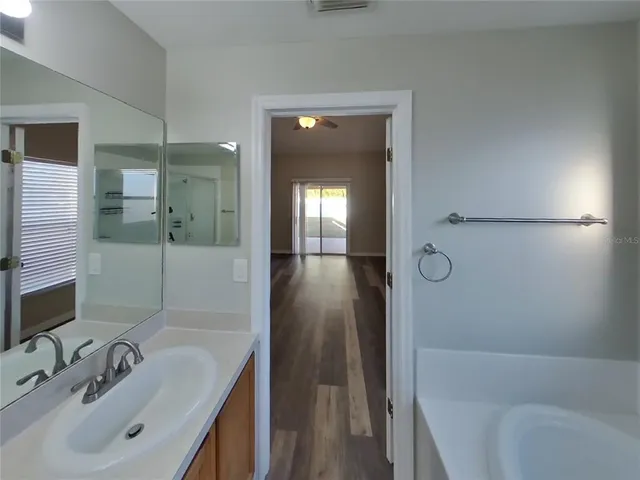 a bathroom with a sink and shower