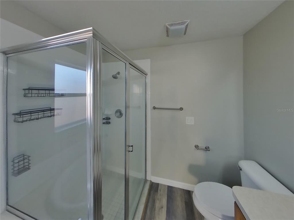 Undisclosed Address Spring Hill, FL 34608 - Photo 10 of 15 a bathroom with a shower and a toilet
