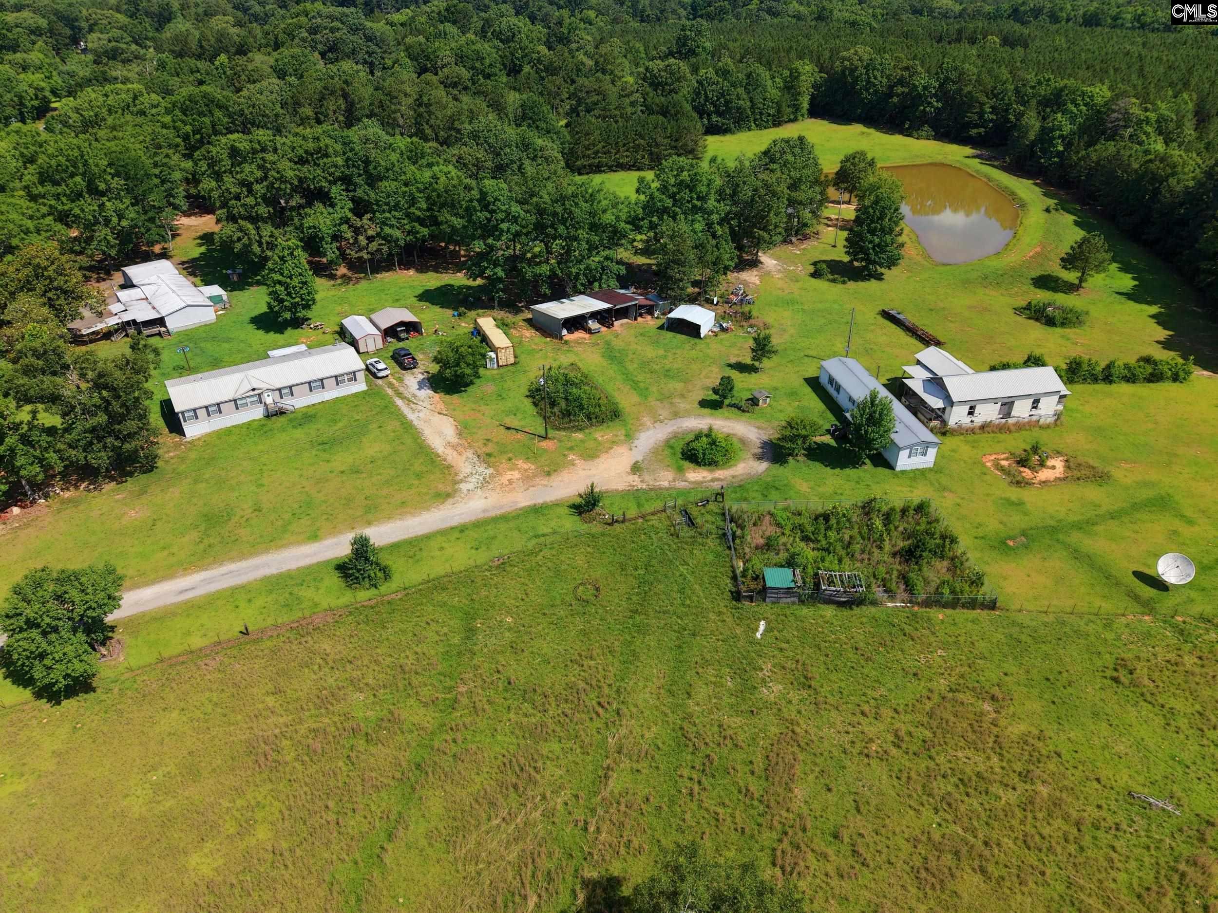 3140 Highway 702 Chappells, SC 29037 - Photo 3 of 39 an aerial view of a residential houses with yard