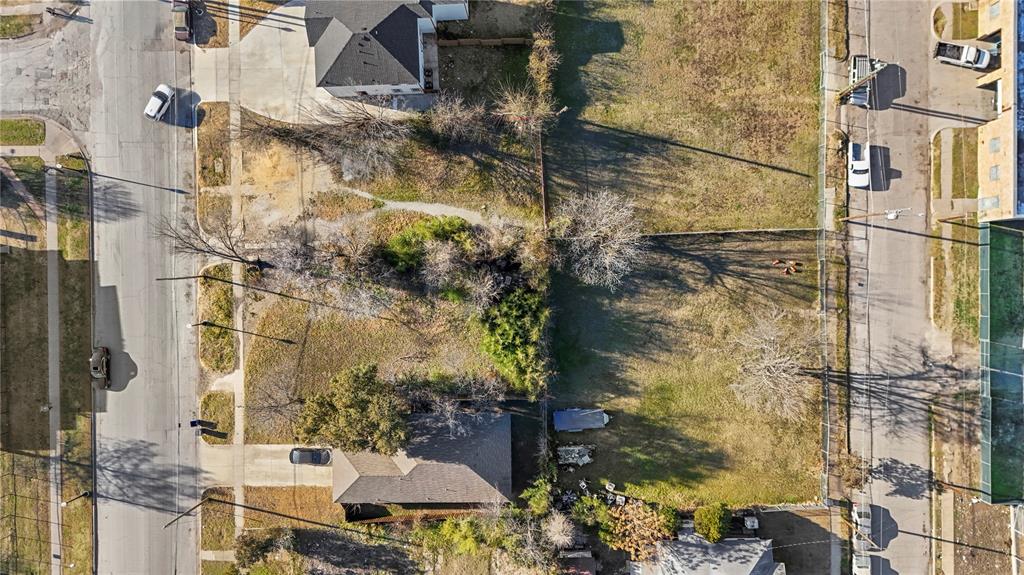2804 Meadow Street Dallas, TX 75215 - Photo 6 of 7 a balcony with table and chairs and potted plants