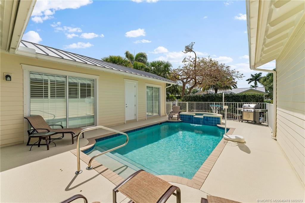 1162 Tropical Drive Jupiter, FL 33458 - Photo 31 of 43 a house view with a sitting space and garden