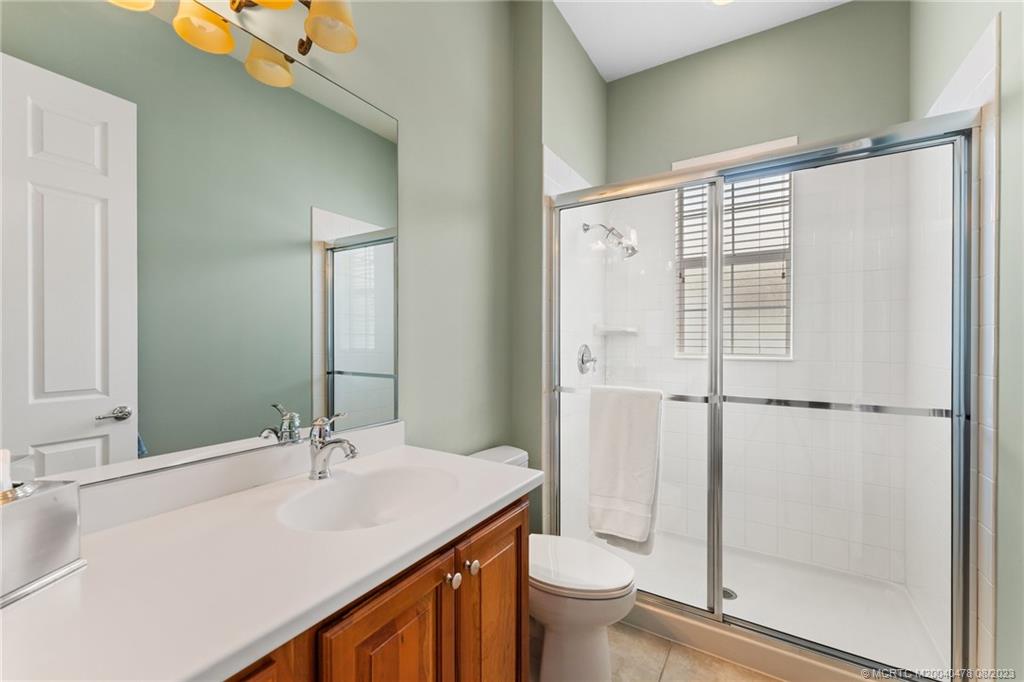 1162 Tropical Drive Jupiter, FL 33458 - Photo 34 of 43 a bathroom with a sink toilet and shower