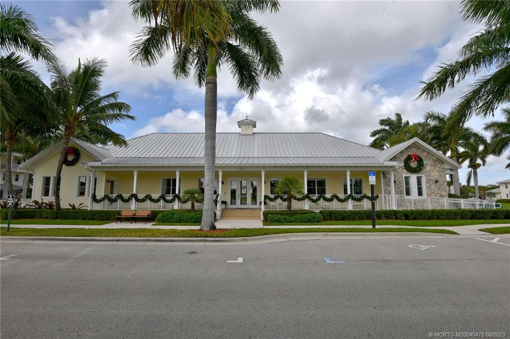 1162 Tropical Drive Jupiter, FL 33458 - Photo 38 of 43 a front view of multiple houses with yard