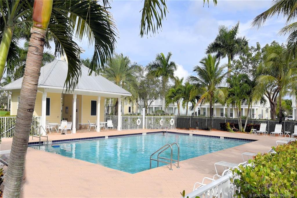 1162 Tropical Drive Jupiter, FL 33458 - Photo 39 of 43 a view of a swimming pool with an outdoor seating