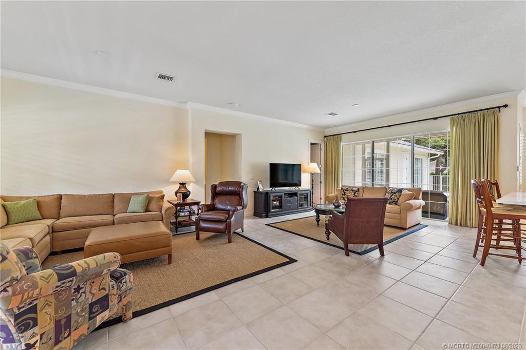 1162 Tropical Drive Jupiter, FL 33458 - Photo 4 of 43 a living room with furniture and a flat screen tv