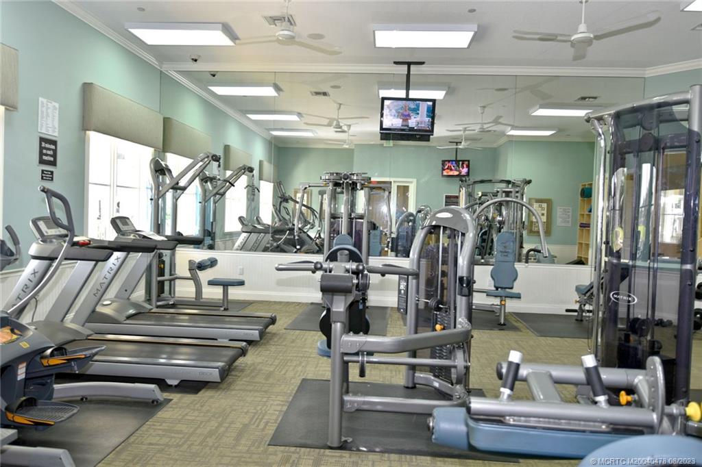 1162 Tropical Drive Jupiter, FL 33458 - Photo 42 of 43 a view of a room with gym equipment