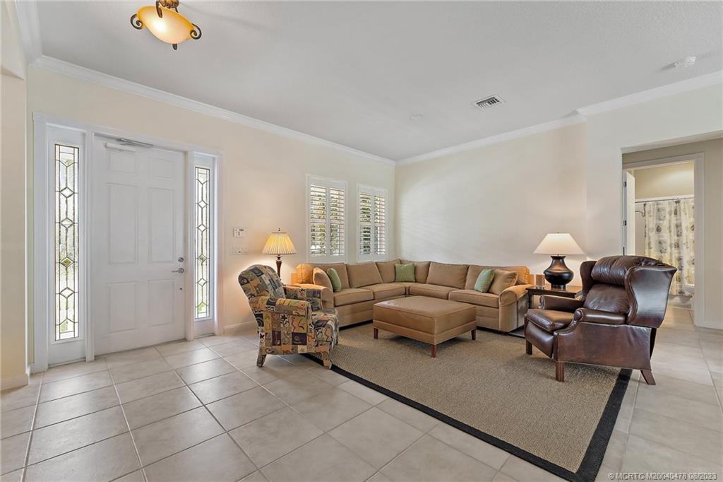 1162 Tropical Drive Jupiter, FL 33458 - Photo 5 of 43 a living room with furniture