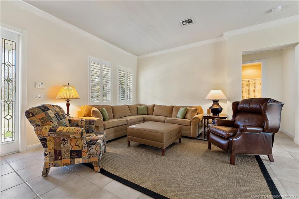 1162 Tropical Drive Jupiter, FL 33458 - Photo 6 of 43 a living room with furniture and a potted plant
