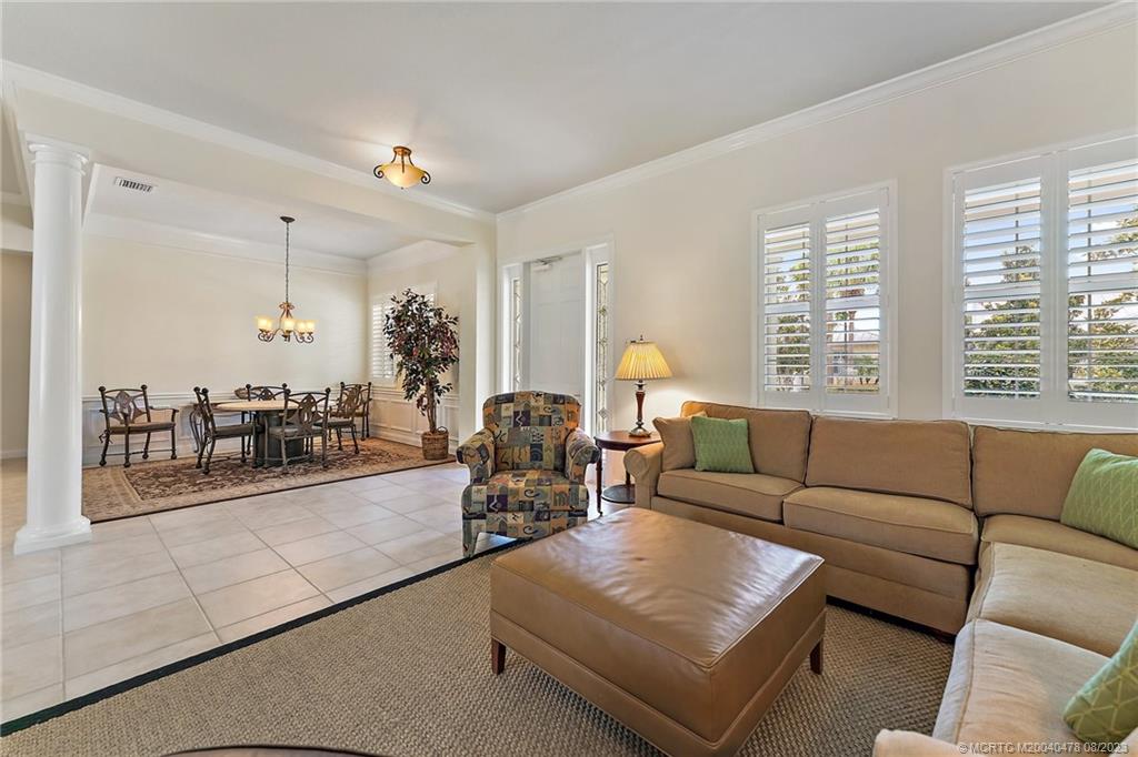 1162 Tropical Drive Jupiter, FL 33458 - Photo 7 of 43 a living room with furniture and a large window