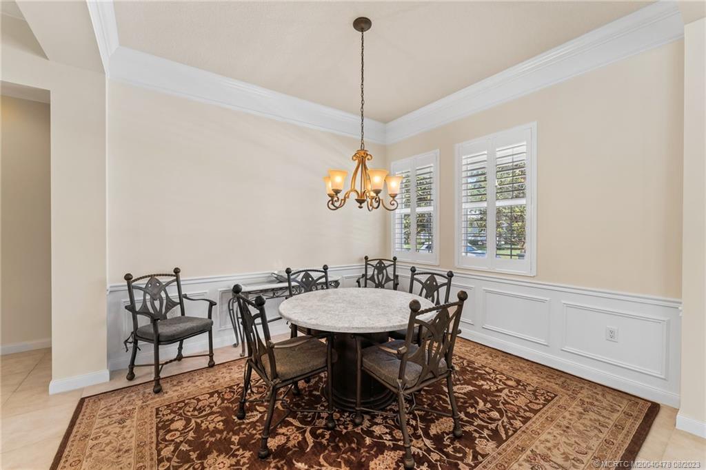1162 Tropical Drive Jupiter, FL 33458 - Photo 8 of 43 a view of a dining room with furniture and window