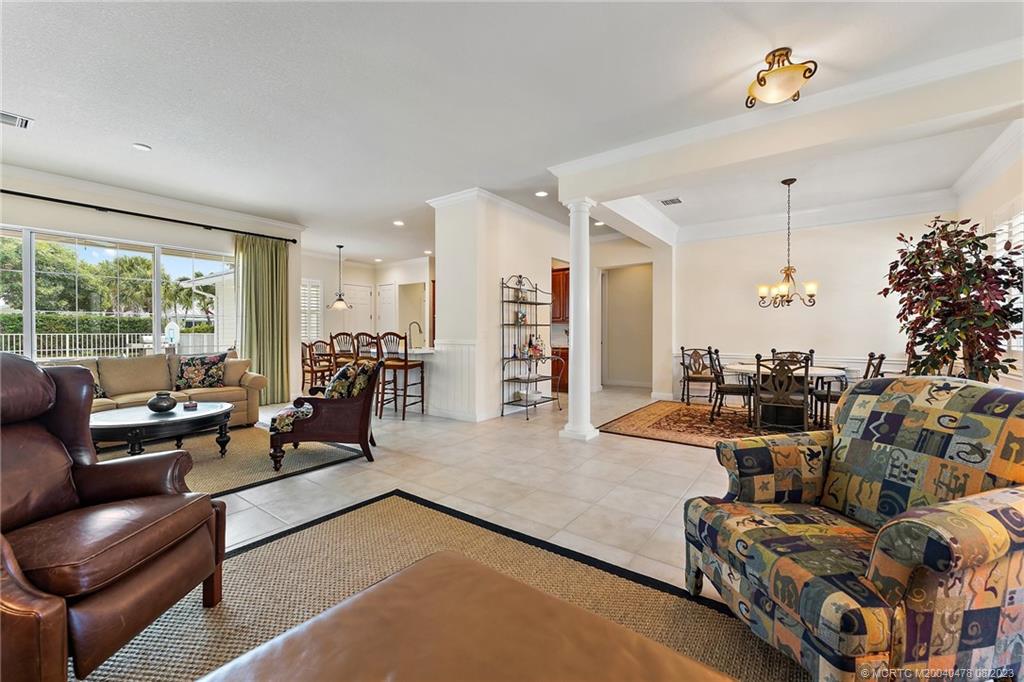 1162 Tropical Drive Jupiter, FL 33458 - Photo 10 of 43 a living room with furniture and a large window