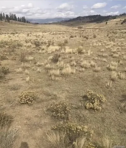 a view of water heater and covered with wooden fence