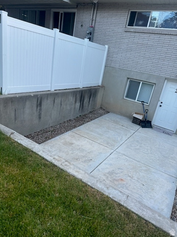 545 100 East Bountiful, UT 84010 - Photo 13 of 17 View of property exterior with a patio and brick siding