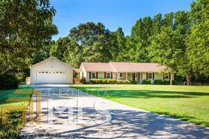 636 Mask Road Brooks, GA 30205 - Photo 1 of 1 a view of a house with a yard and sitting area