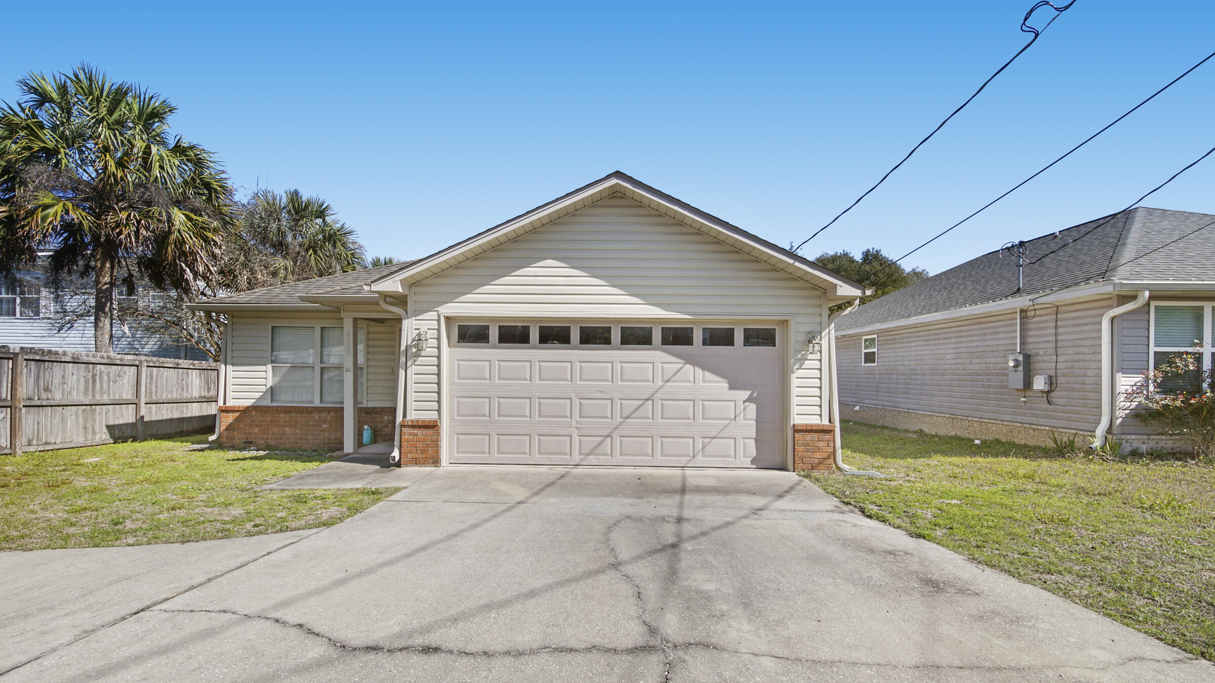 908 Valley Road Crestview, FL 32539 - Photo 1 of 22 a front view of a house with a yard and garage
