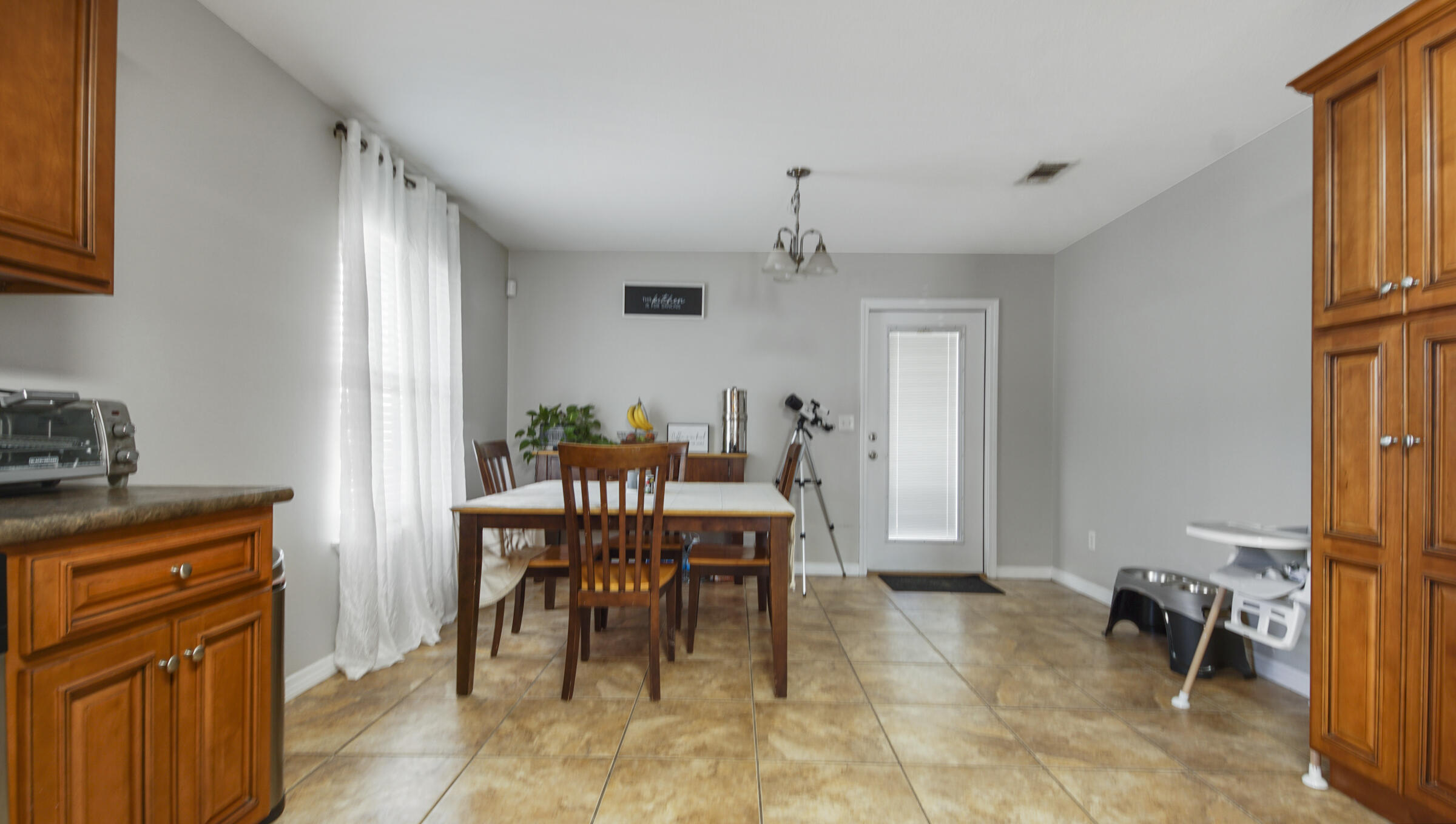 908 Valley Road Crestview, FL 32539 - Photo 14 of 22 a view of a dining room with furniture