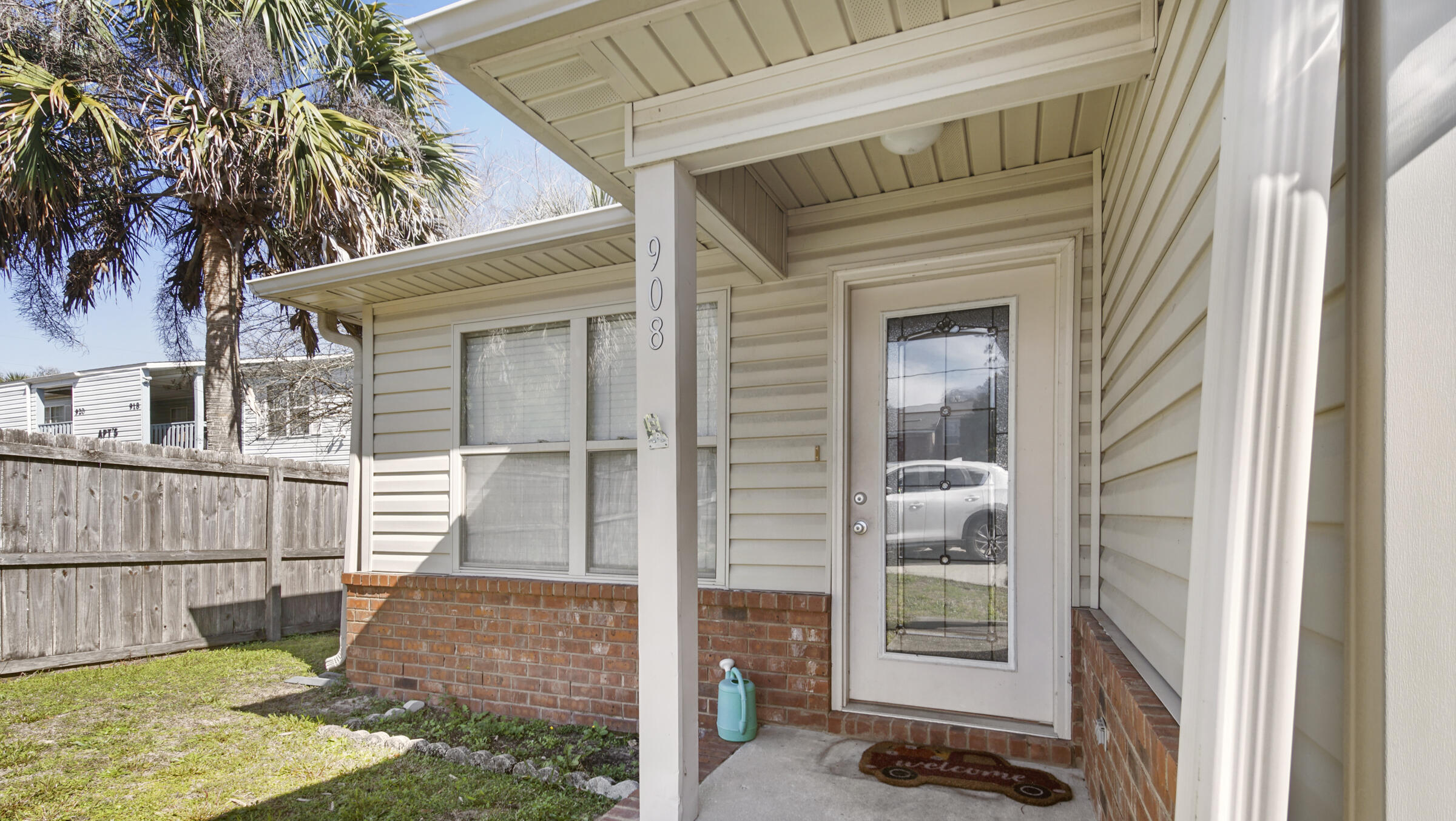 908 Valley Road Crestview, FL 32539 - Photo 2 of 22 a view of a house with a small yard and wooden floor and fence