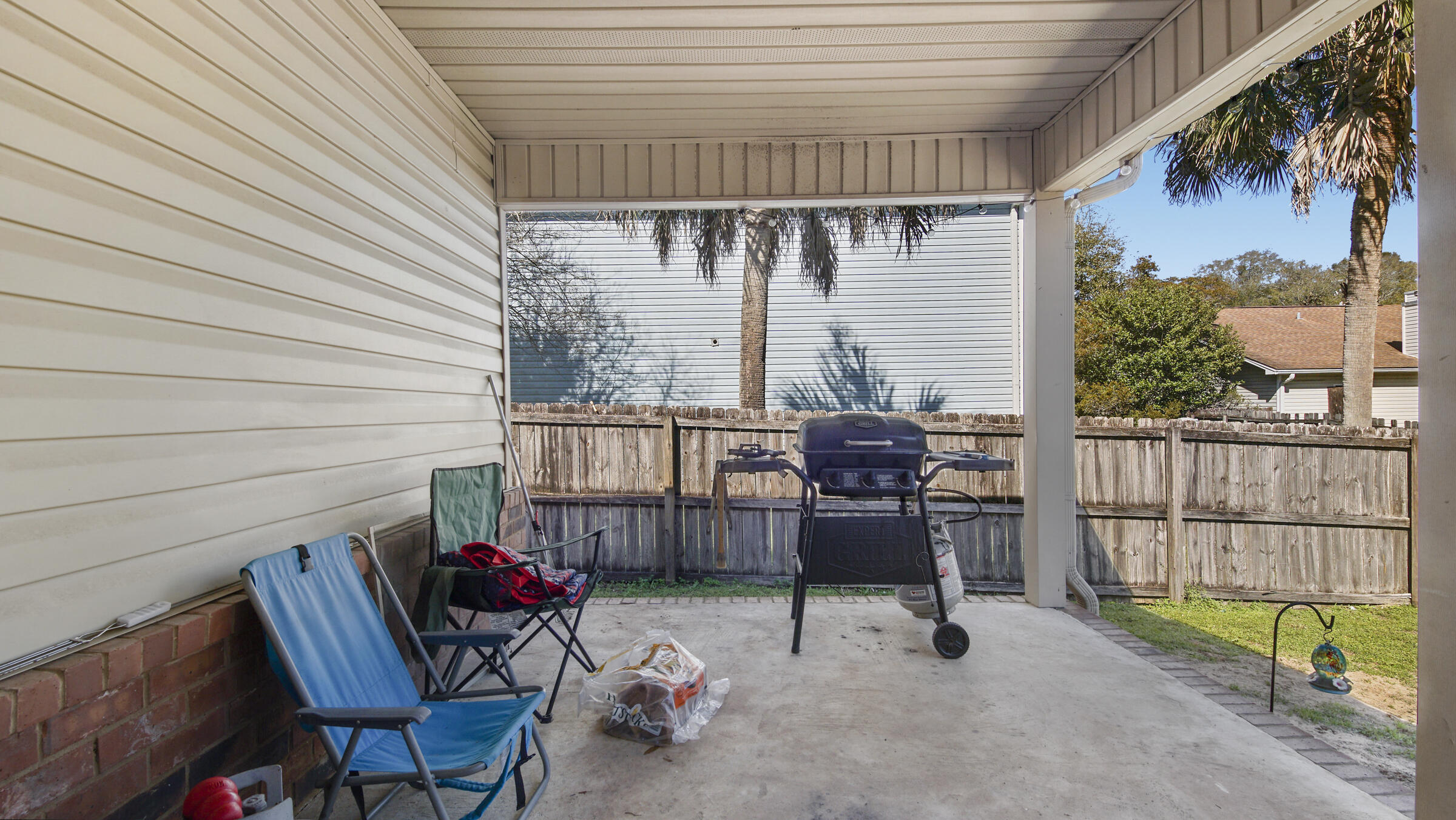 908 Valley Road Crestview, FL 32539 - Photo 3 of 22 a view of a patio with a table and chairs