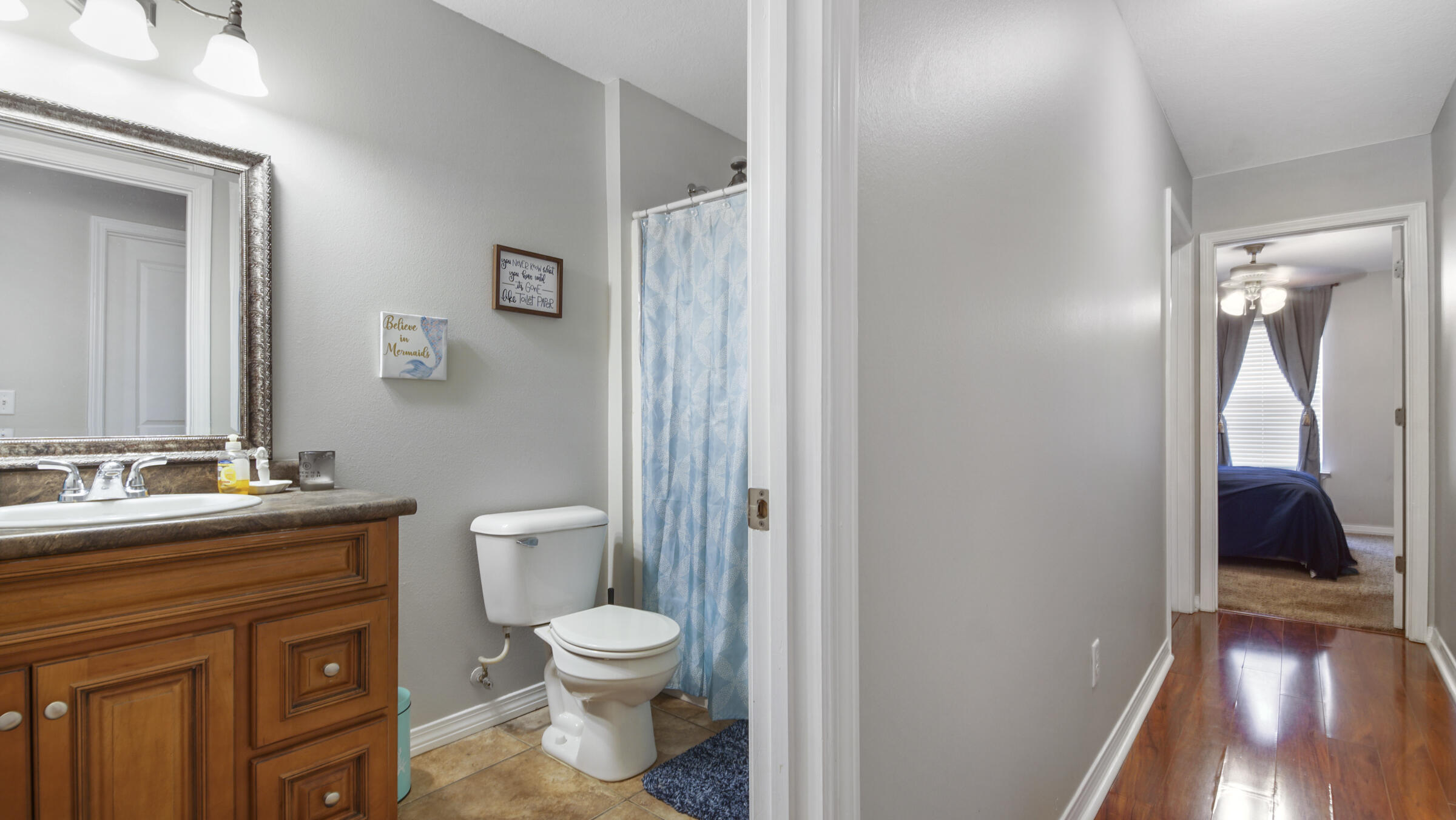 908 Valley Road Crestview, FL 32539 - Photo 4 of 22 a bathroom with a toilet a sink and vanity