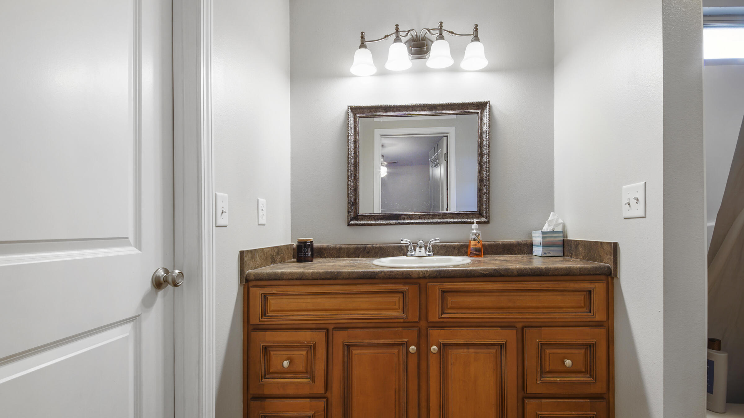 908 Valley Road Crestview, FL 32539 - Photo 7 of 22 a bathroom with a sink and a mirror