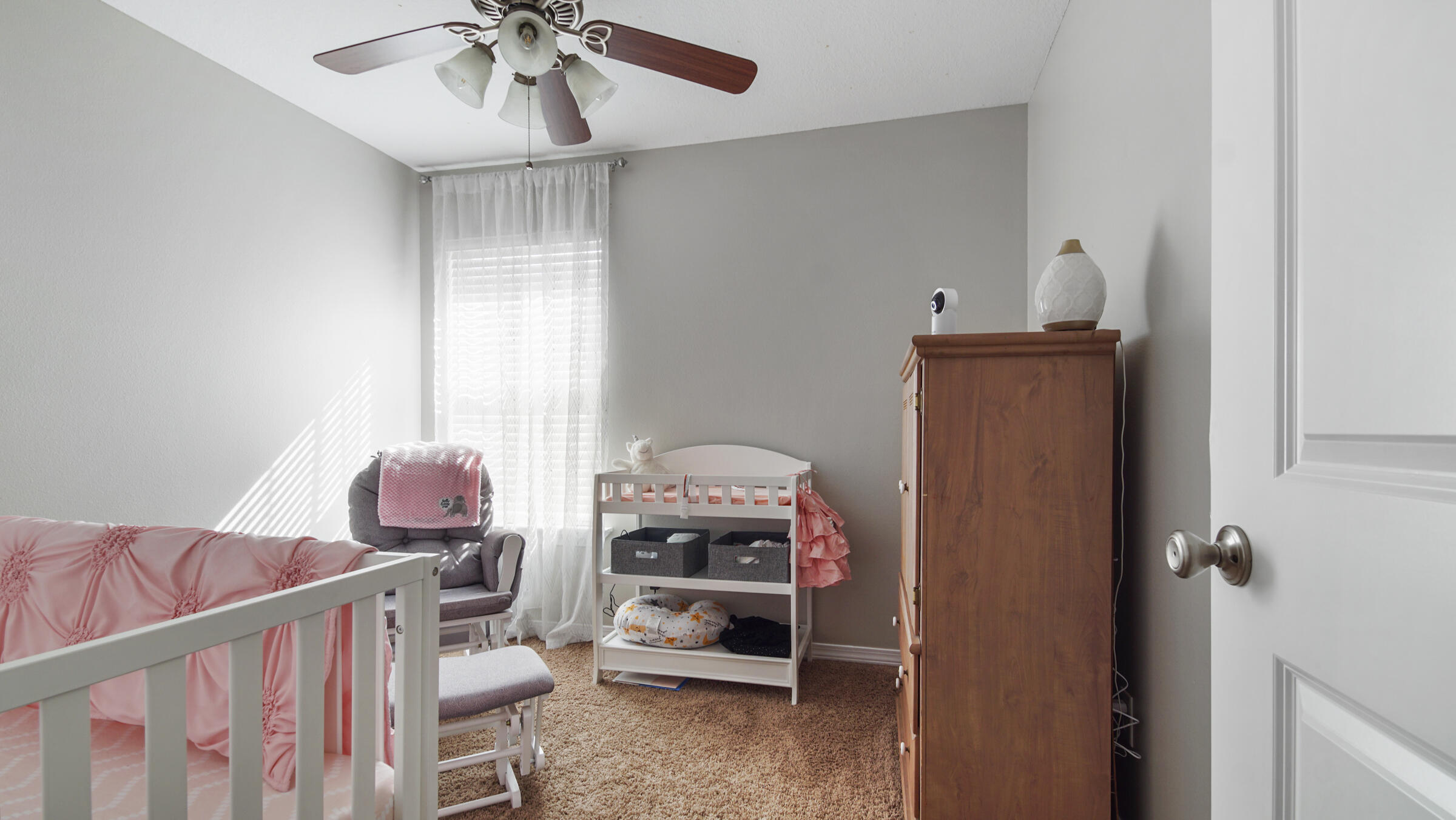908 Valley Road Crestview, FL 32539 - Photo 10 of 22 a bedroom with furniture and a chandelier
