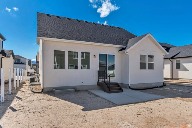 1302 1475 East, Unit 40 Payson, UT 84651 - Photo 33 of 34 Back of property with stucco siding and a shingled roof
