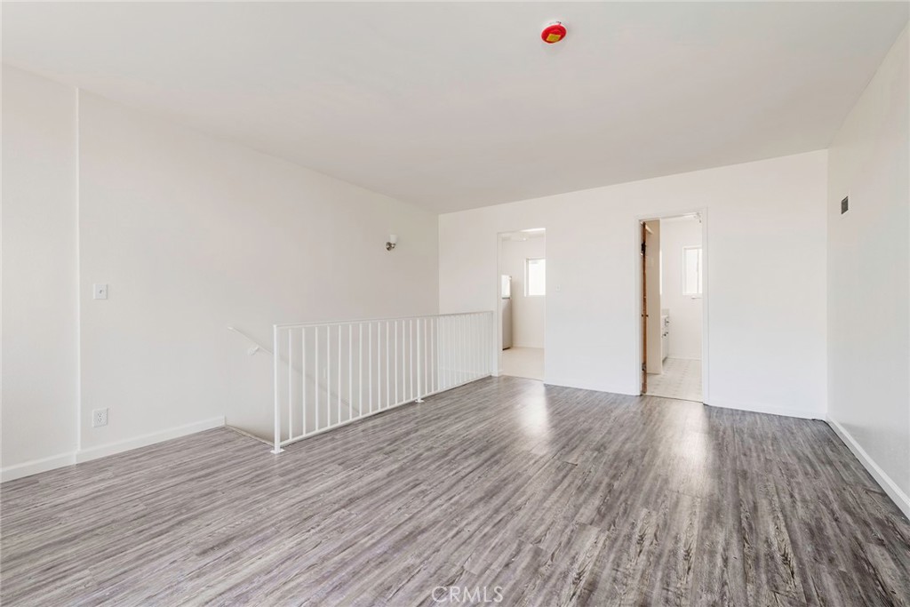 24 Roswell Avenue Long Beach, CA 90803 - Photo 6 of 13 a view of an empty room with wooden floor