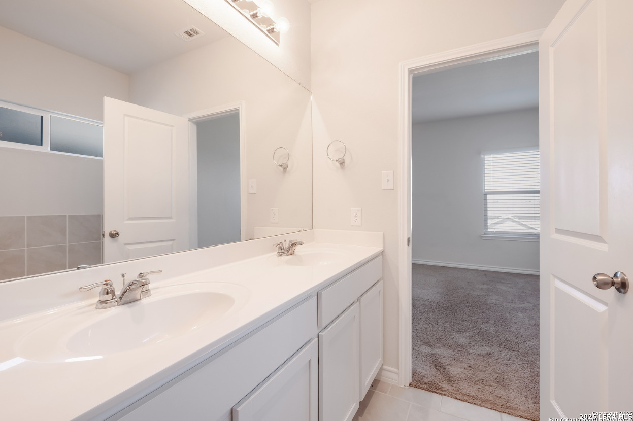 2943 Pemberton Post San Antonio, TX 78245 - Photo 13 of 19 a bathroom with a sink and a mirror
