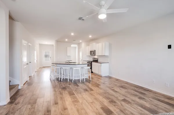 a view of kitchen with wooden floor and window