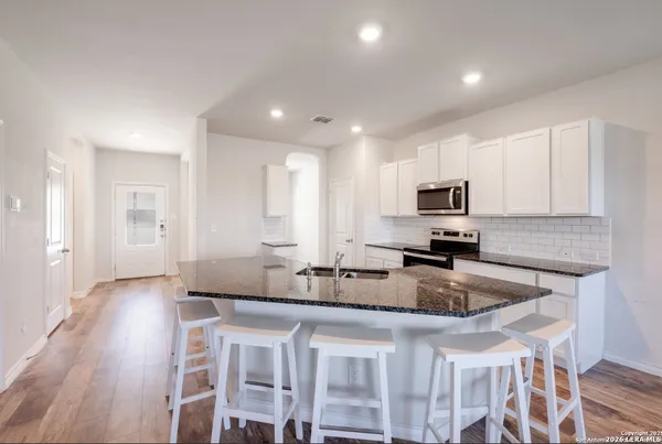 a kitchen with granite countertop a sink and counter space