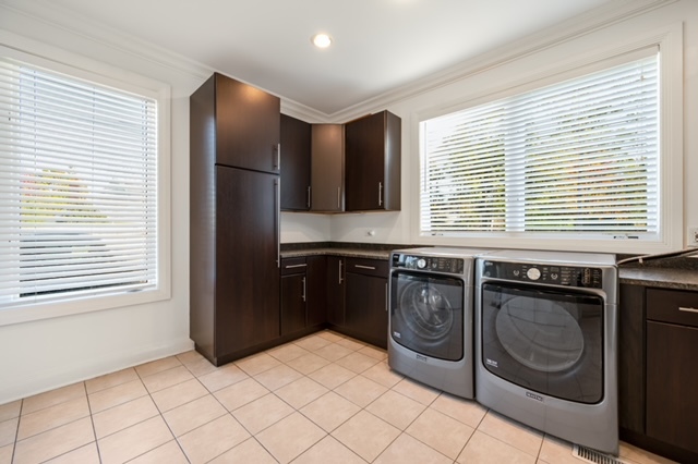 115 Dickens Road Northfield, IL 60093 - Photo 20 of 24 a kitchen with granite countertop a sink cabinets and stainless steel appliances