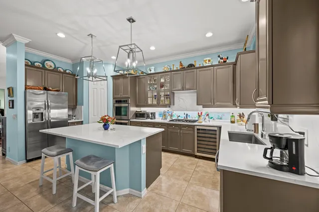 a kitchen with sink and cabinets