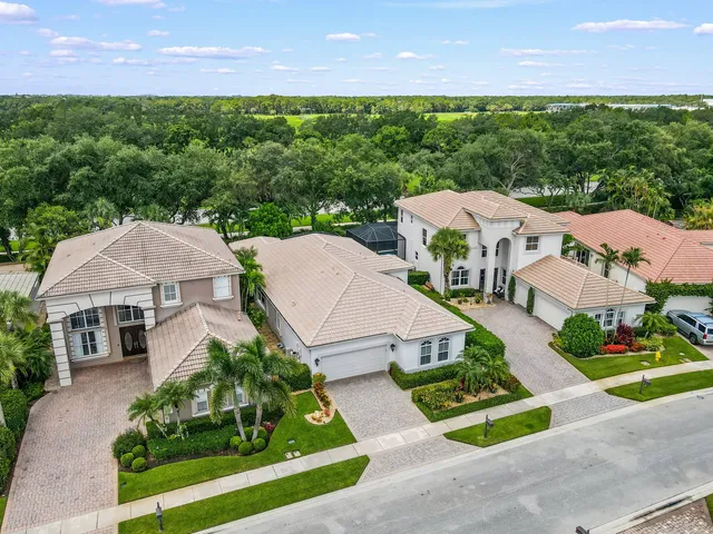 an aerial view of a house with a garden and plants