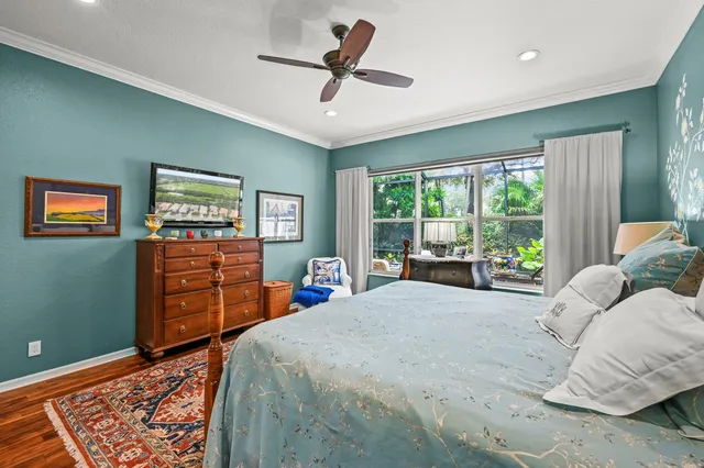 a bed room with a bed and a dresser