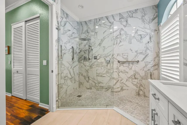 a bathroom with a bathtub and shower