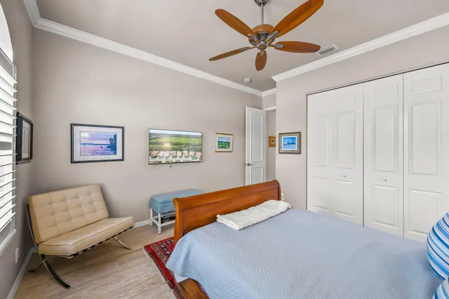 a bedroom with a bed and a couch