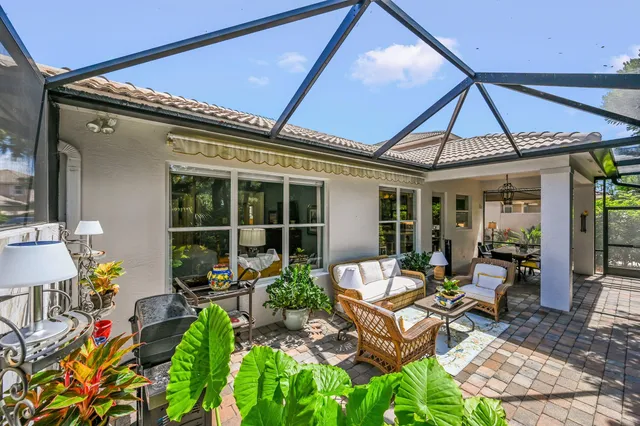 a front view of a house with sitting area