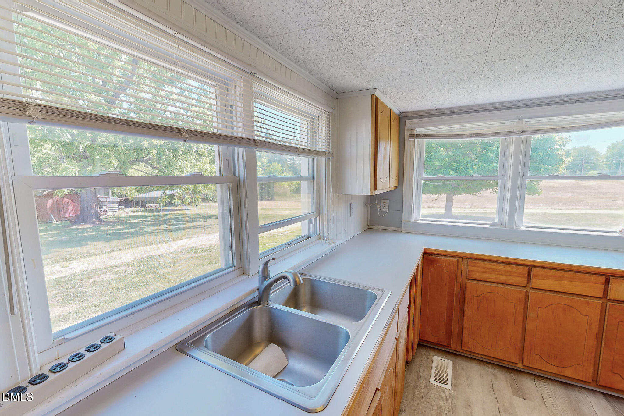 1001 Charlie Reade Road Timberlake, NC 27583 - Photo 11 of 64 a view of a kitchen with a sink and large window