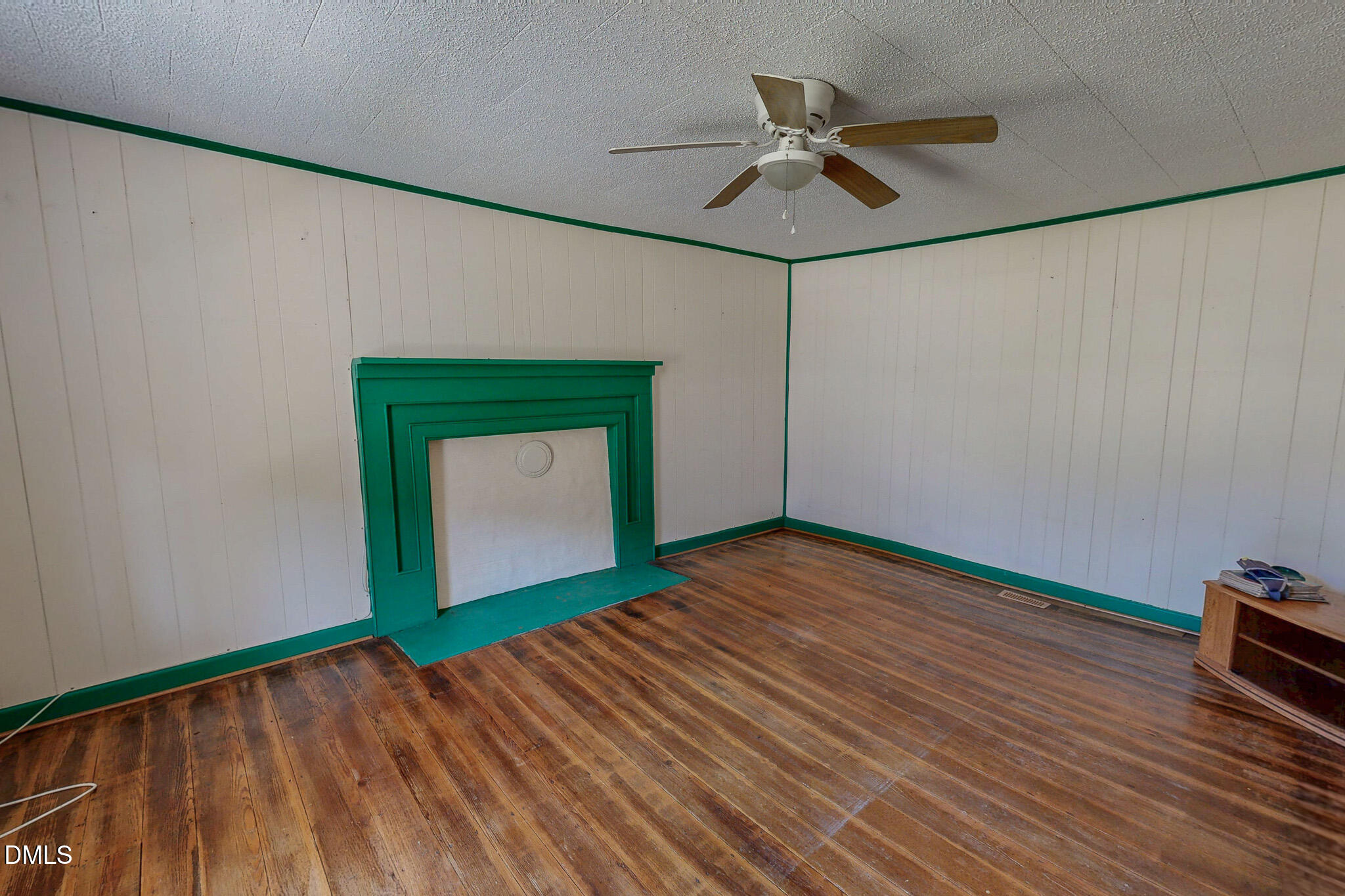 1001 Charlie Reade Road Timberlake, NC 27583 - Photo 26 of 64 a view of an empty room with a window and wooden floor