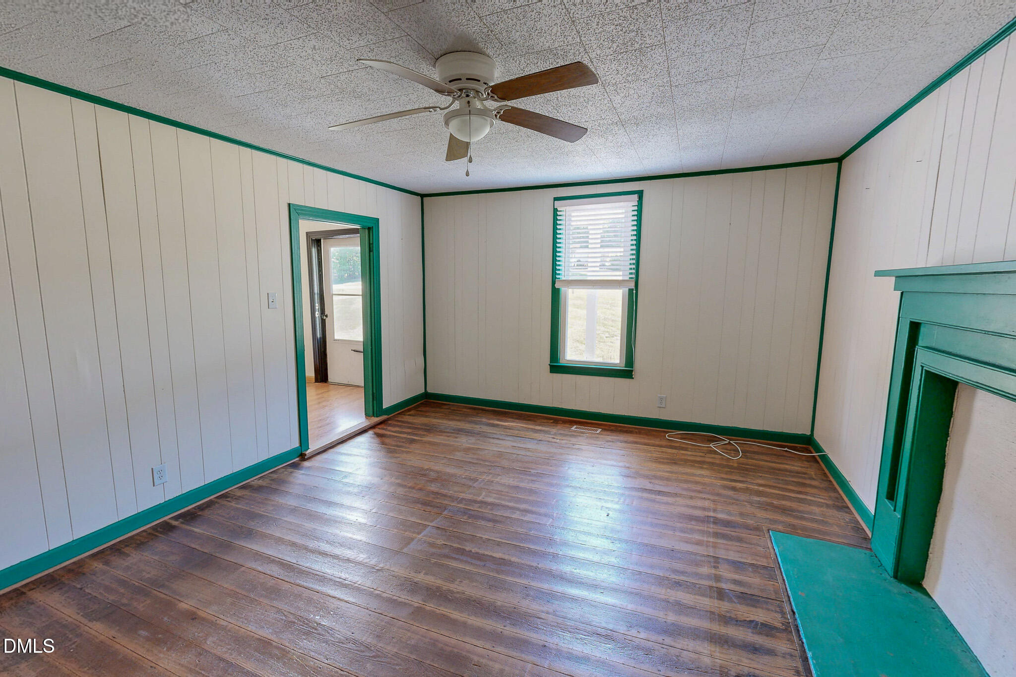 1001 Charlie Reade Road Timberlake, NC 27583 - Photo 27 of 64 an empty room with wooden floor and windows