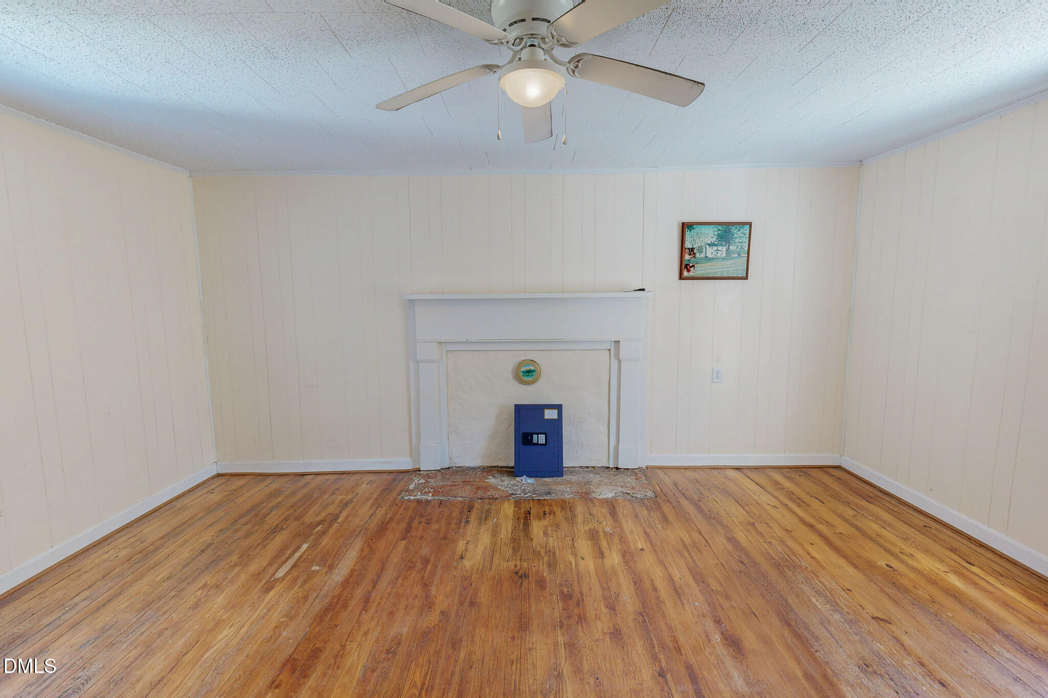 1001 Charlie Reade Road Timberlake, NC 27583 - Photo 28 of 64 a view of a room with wooden floor and a ceiling fan